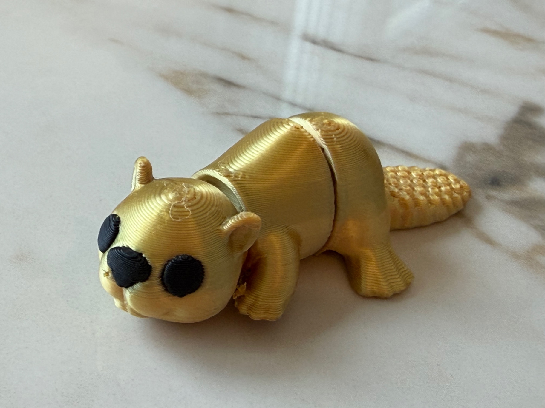 Golden Otter — Shiny gold otter with a bendy body