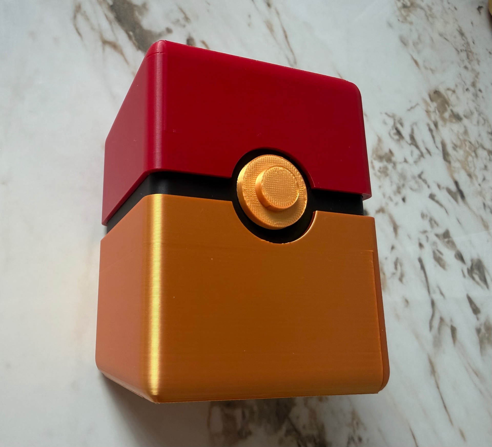 Buddy Cube Case — Red and gold cube case with a click-open lid