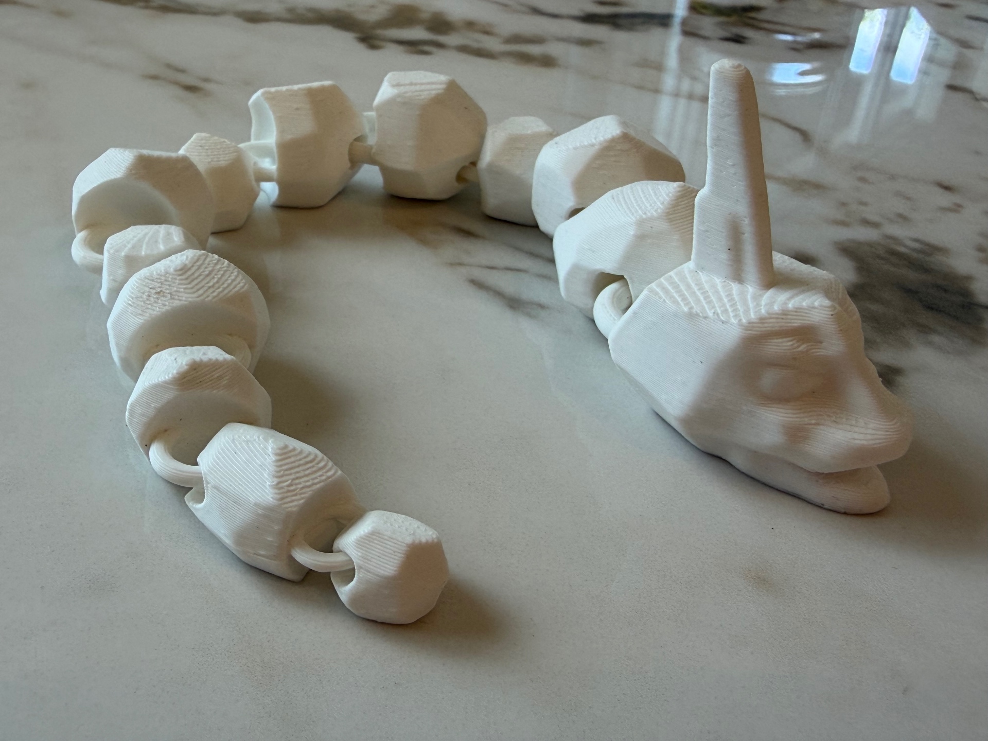 Coil Serpent — Chunky white snake that curls up to rest