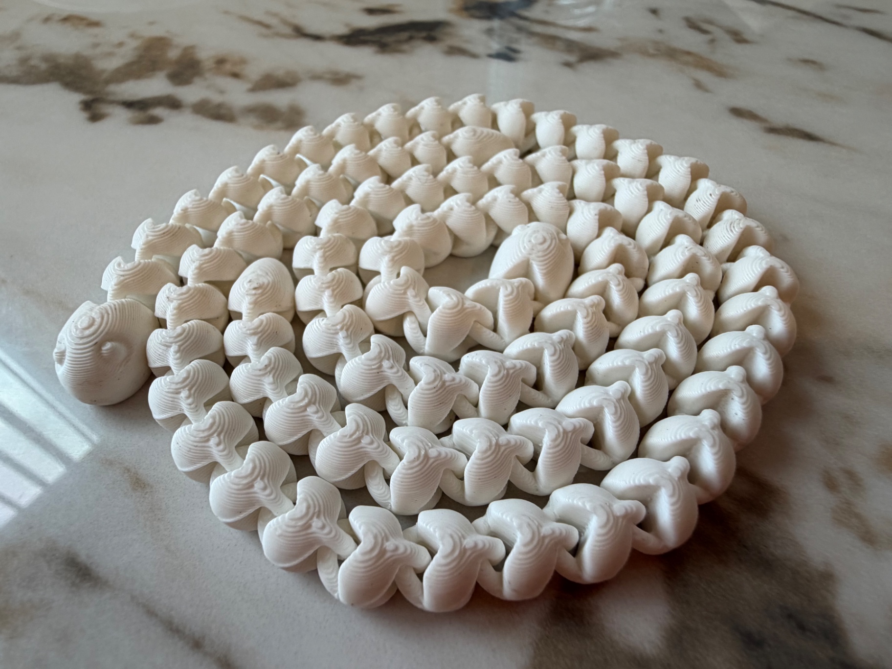 Spiral Centipede — Coiled fidget crawler with dozens of joints