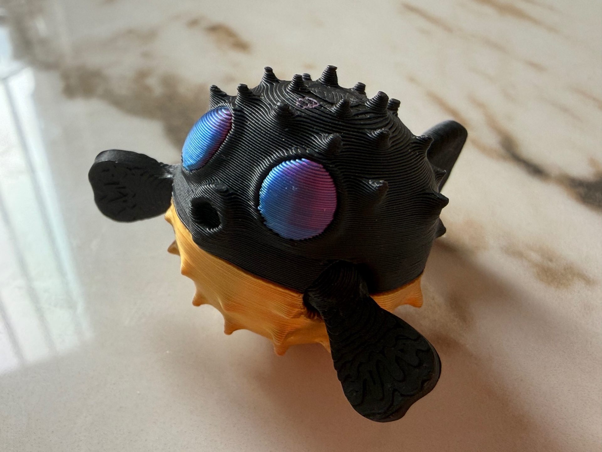 Puffer Pal — Spiky puffer fish with color-shift eyes