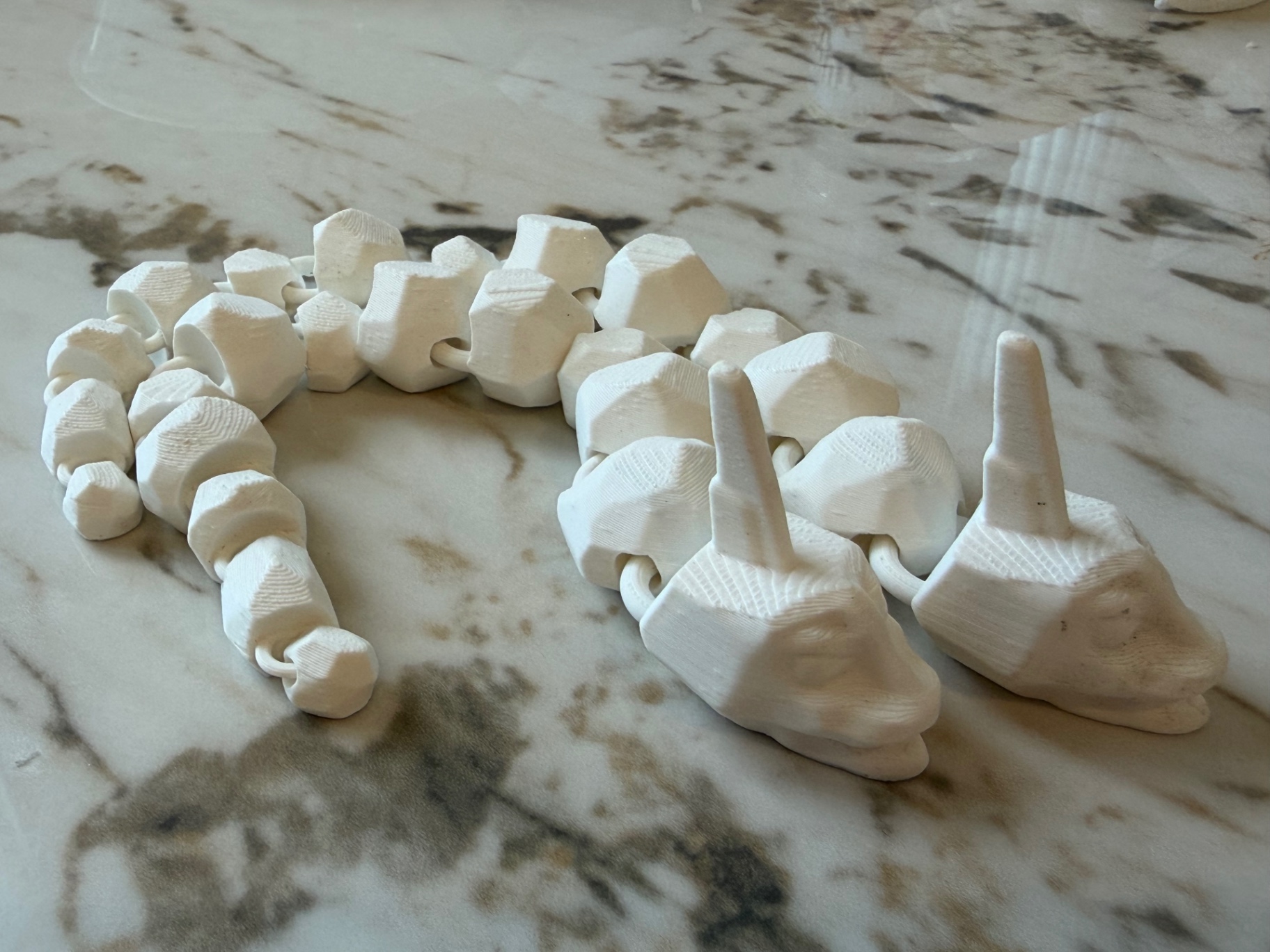Ivory Serpent — Bone-white snake pair, link by link