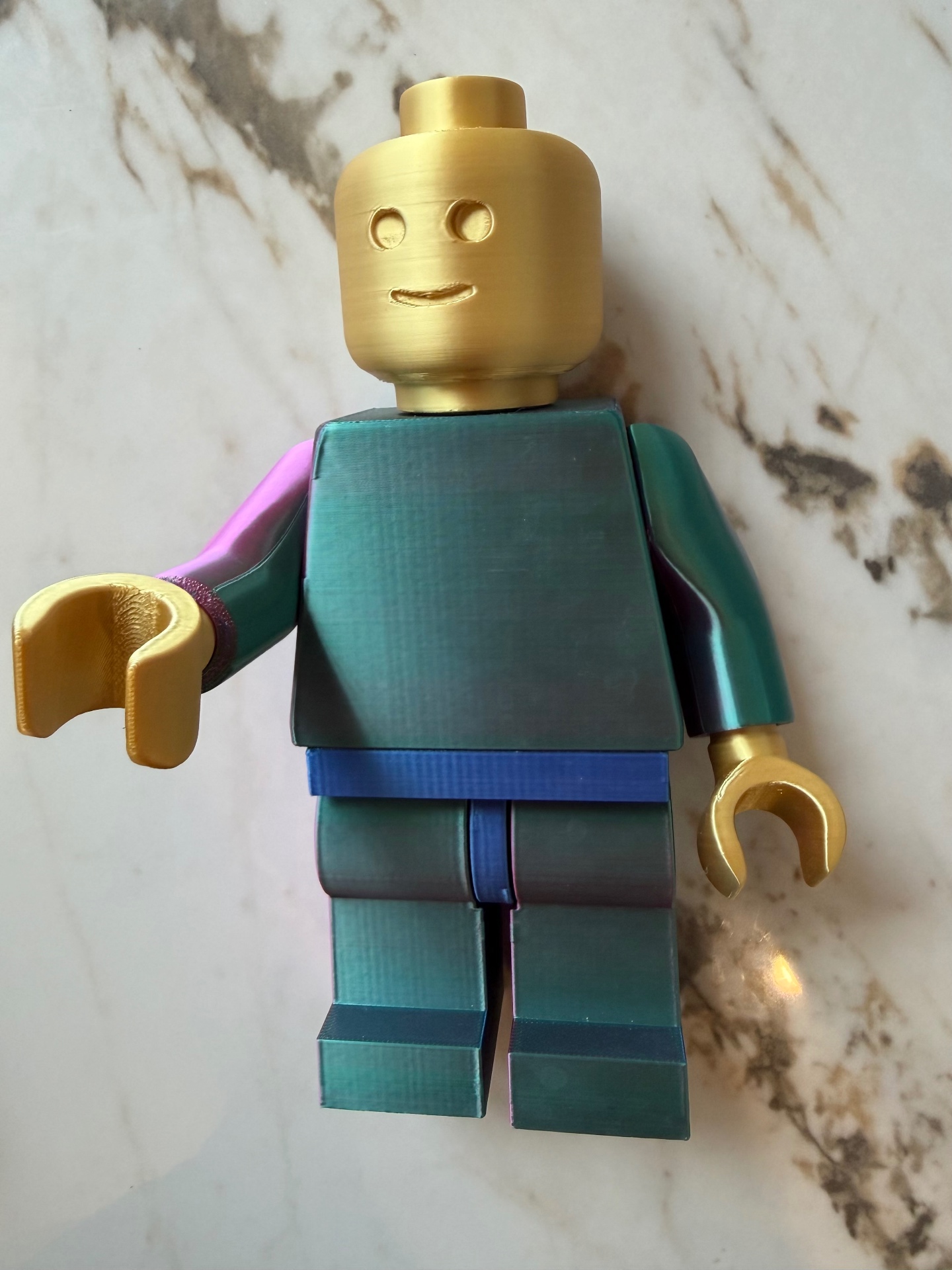 Brick Buddy — Poseable minifig with gold head and color-shift suit