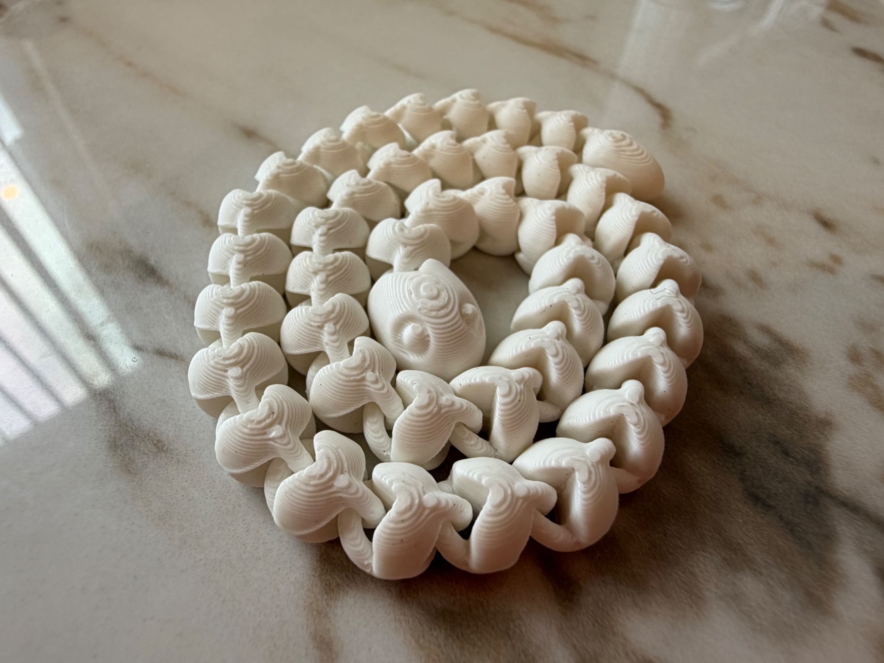 Mini Centipede — Pocket-size coiled crawler
