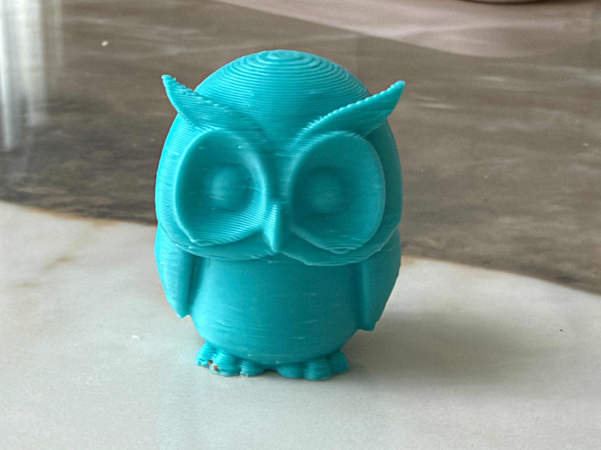 Teal Owl — Bright teal owl with big round eyes and flared ear tufts