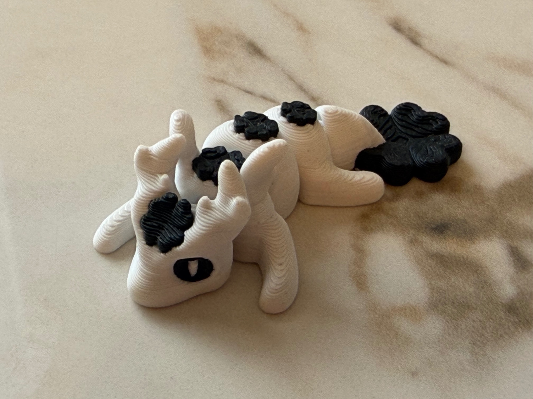 Cloud Dragon — Cream and black spotted flexi dragon