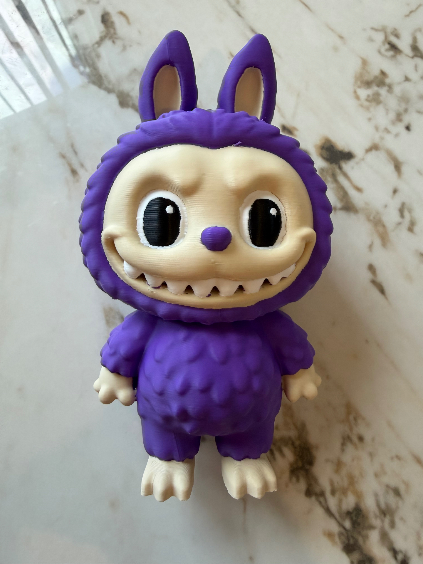 Purple Bunny Buddy — Grinning bunny-hood monster in purple and cream