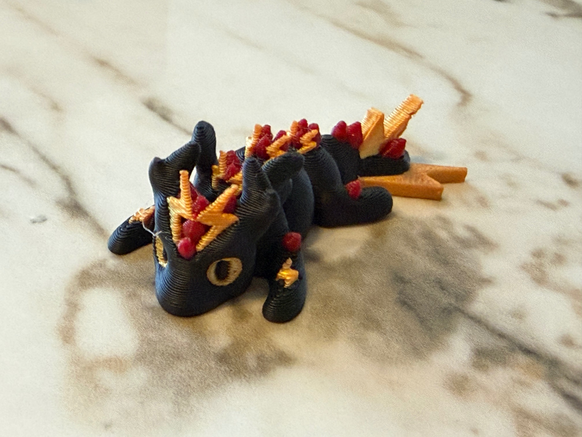 Crown Dragon — Black dragon with ruby and gold crown spikes